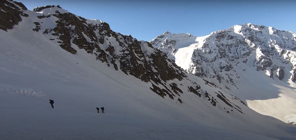 Snow wall at Buran Ghati pass with rappellers